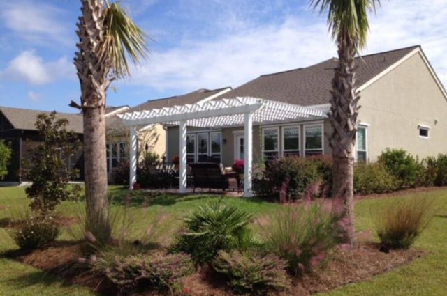 home with custom vinyl pergola attached to home in south carolina