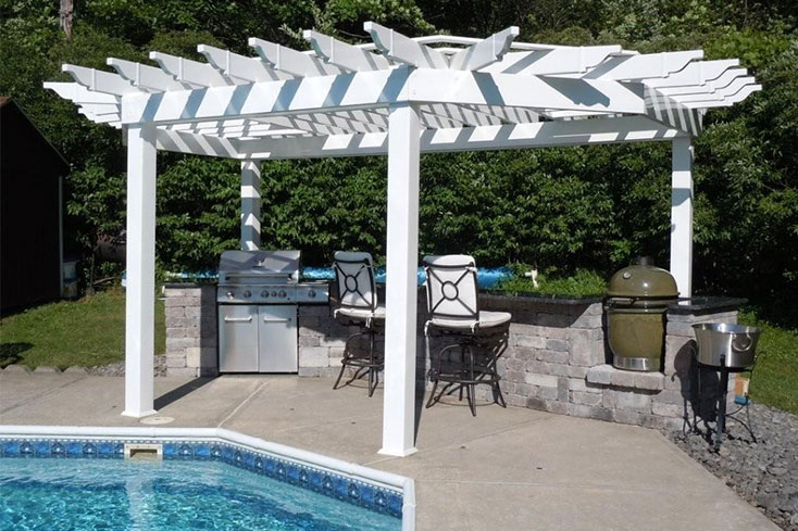 outdoor kitchen by pool