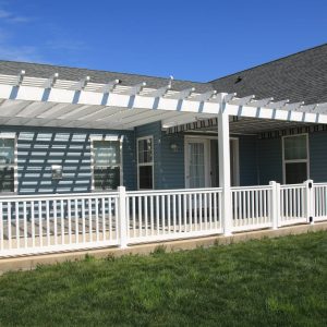 vinyl pergola attached to a house