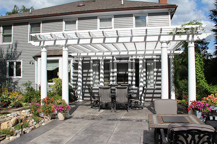 pergola over a patio dining area