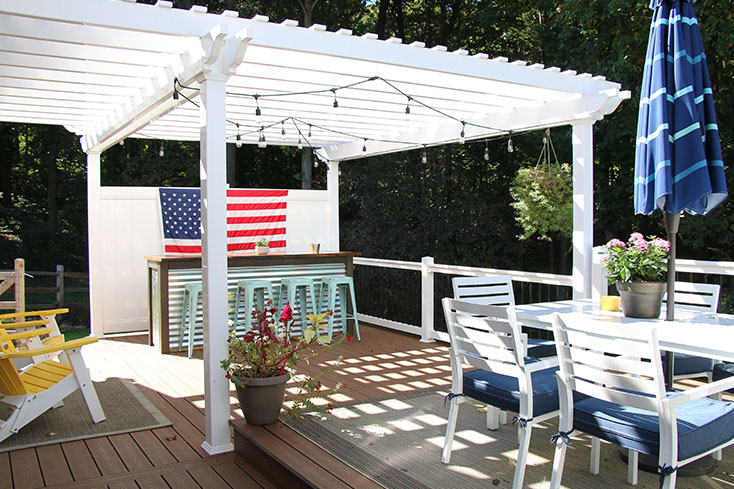 backyard space with vinyl pergola