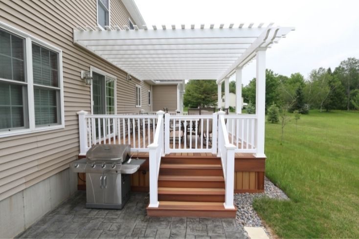 Attached pergola over backyard seating area