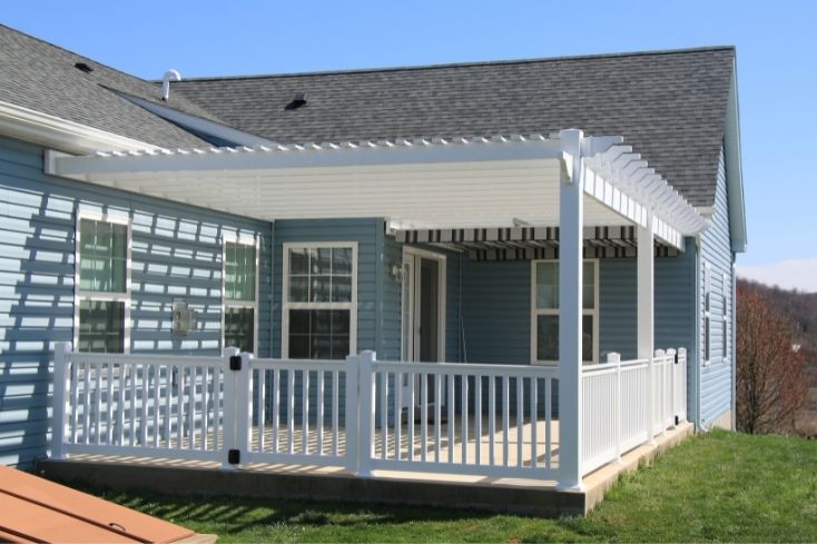 Attached pergola on home with backyard patio