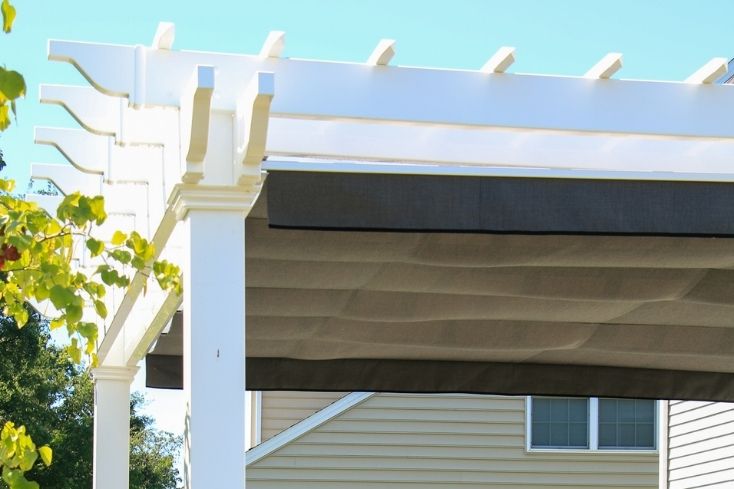 Roof of maintenance free white vinyl pergola on deck