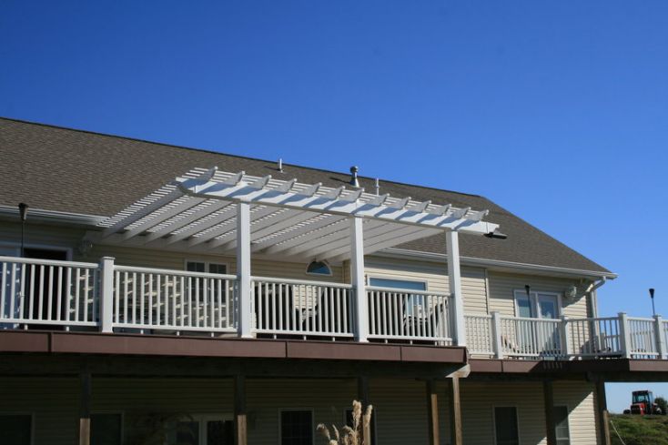 white vinyl pergola on deck attached to the house