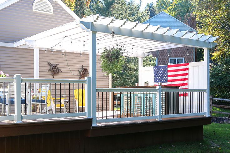 large attached pergola with entertainment bar and dining area