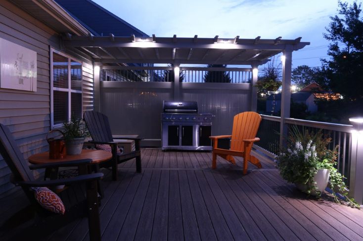 custom made pergola lit up at dusk