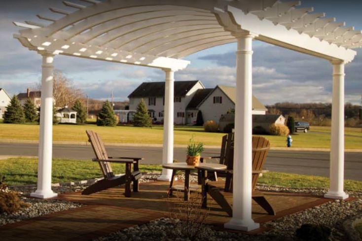 front yard pergola with seating area